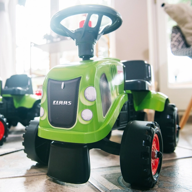 Odstrkovadlo traktor Claas zelené s volantem a valníkem