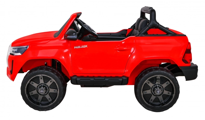 Toyota Hilux baterie pro děti Červená + pohon 4x4 + dálkové ovládání + 2 nosiče zavazadel + rádio MP3 + LED dioda