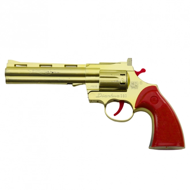 Zlatý revolver na kapsle s efektem zvuku výstřelu
