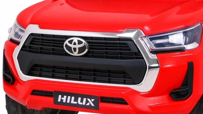 Toyota Hilux baterie pro děti Červená + pohon 4x4 + dálkové ovládání + 2 nosiče zavazadel + rádio MP3 + LED dioda