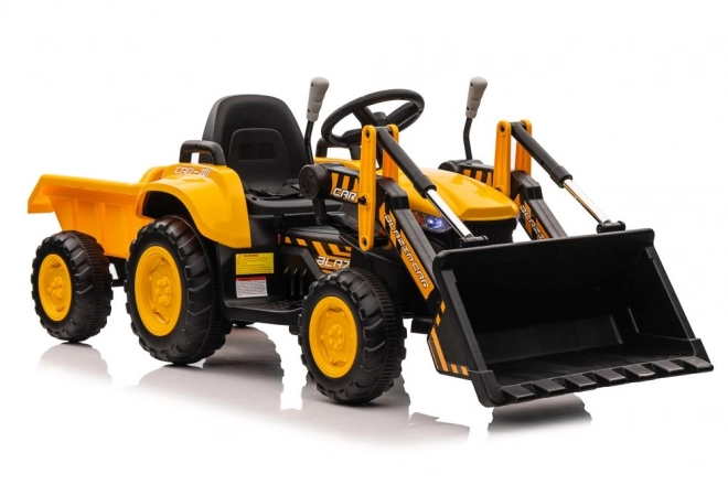 Elektrický traktor s lžící žlutý