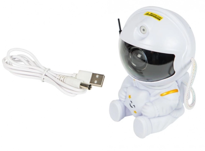 Hvězdný projektor sedící astronaut s dálkovým ovládáním