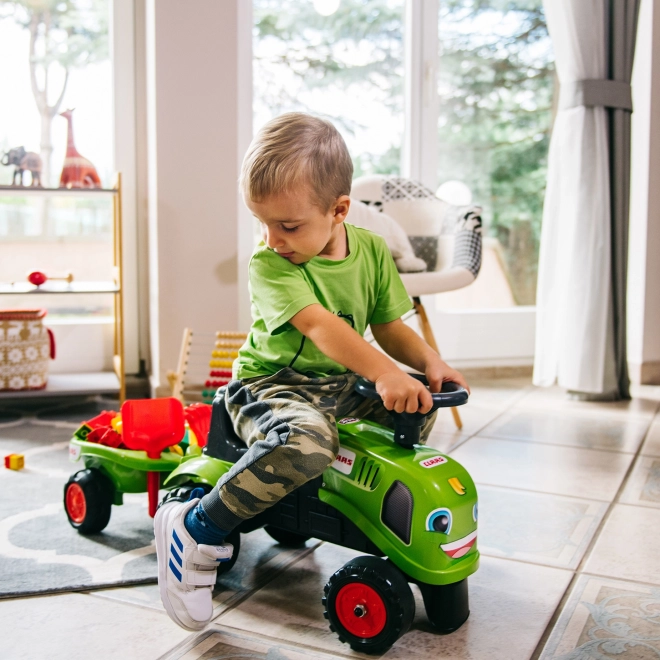 Odstrkovadlo traktor Claas zelené s volantem a valníkem