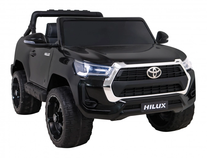 Toyota Hilux baterie pro děti černá + pohon 4x4 + dálkové ovládání + 2 nosiče zavazadel + rádio MP3 + LED dioda