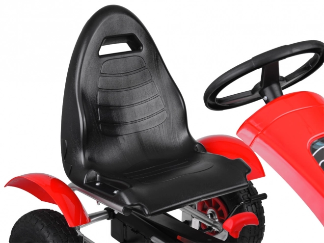 Sportovní zelený šlapací motokára s nafukovacími koly