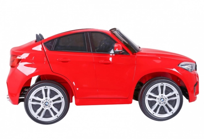 BMW X6M XXL pro 2 děti Červená + dálkové ovládání + eko kůže + bezpečnostní pásy + pomalý rozjezd + MP3 USB + LED dioda