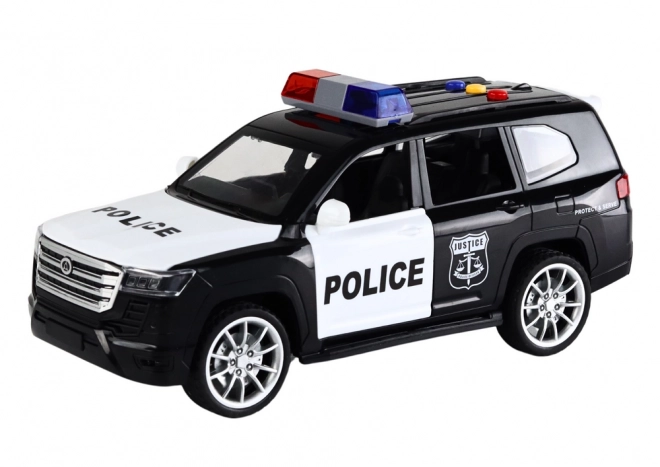 Policejní auto s efekty, otevíracími dveřmi a měřítkem 1:14
