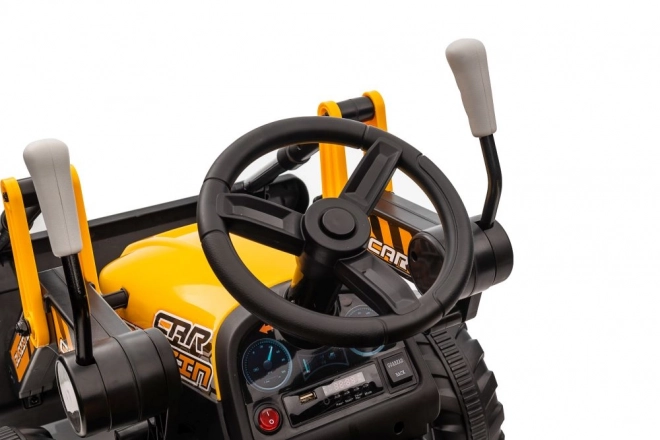 Elektrický traktor s lžící žlutý