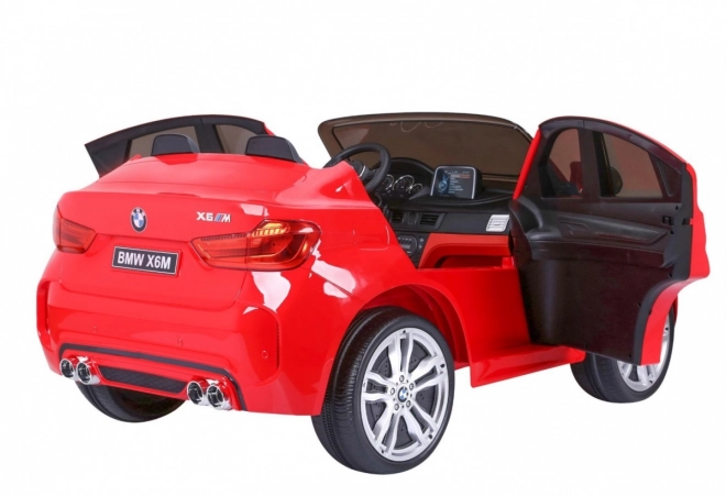 BMW X6M XXL pro 2 děti Červená + dálkové ovládání + eko kůže + bezpečnostní pásy + pomalý rozjezd + MP3 USB + LED dioda