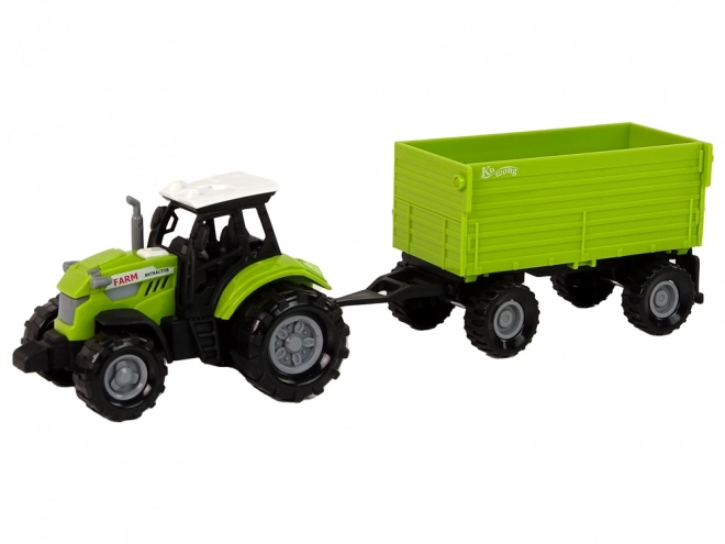 Zelený zemědělský traktor s přívěsem
