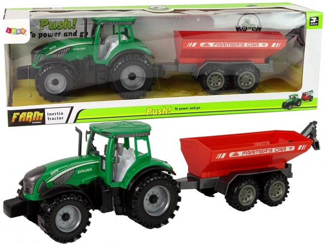 Zelený traktor s červeným třecím pohonem přívěsu