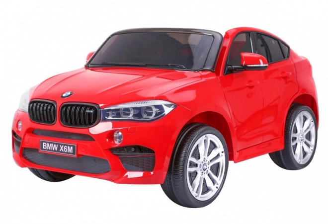 BMW X6M XXL pro 2 děti Červená + dálkové ovládání + eko kůže + bezpečnostní pásy + pomalý rozjezd + MP3 USB + LED dioda