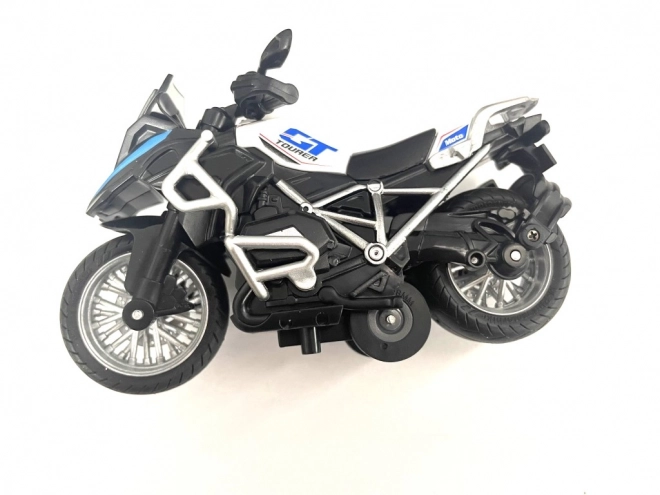Závodní motorka s pružinovým pohonem
