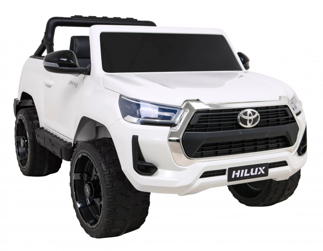 Toyota Hilux baterie pro děti Bílá + pohon 4x4 + dálkové ovládání + 2 nosiče zavazadel + rádio MP3 + LED dioda