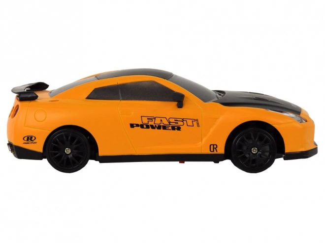 Dálkově ovládané sportovní auto R/C 1:24 vyměnitelná kola – žluté