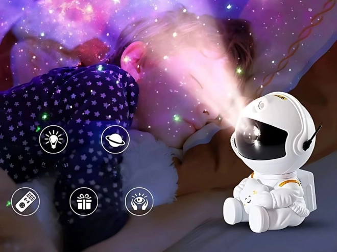Hvězdný projektor sedící astronaut s dálkovým ovládáním