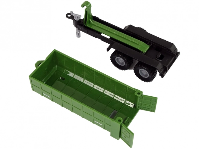 Traktor s odpojitelným přívěsem zelený