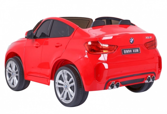 BMW X6M XXL pro 2 děti Červená + dálkové ovládání + eko kůže + bezpečnostní pásy + pomalý rozjezd + MP3 USB + LED dioda