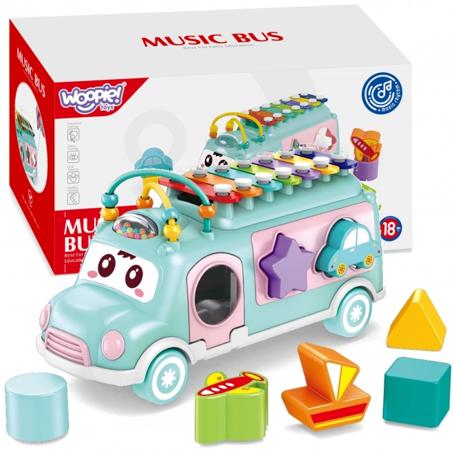 Woopie muzicírovací auto se zeleným sorterem a xylofonem