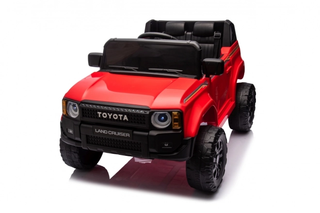 Czerwony pojazd Toyota Land Cruiser Prado