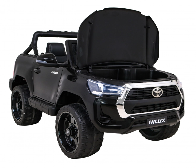 Toyota Hilux baterie pro děti černá + pohon 4x4 + dálkové ovládání + 2 nosiče zavazadel + rádio MP3 + LED dioda