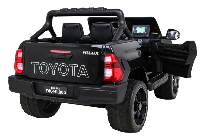 Toyota Hilux baterie pro děti černá + pohon 4x4 + dálkové ovládání + 2 nosiče zavazadel + rádio MP3 + LED dioda