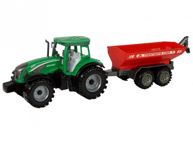 Zelený traktor s červeným třecím pohonem přívěsu