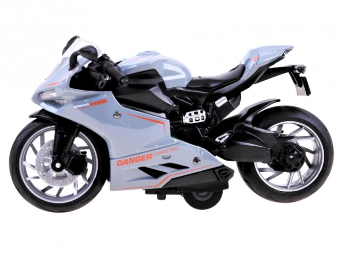 Kovový model motocyklu s nápínákem – A