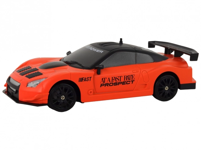 Dálkově ovládané R/C sportovní auto 1:24 Oranžová vyměnitelná kola