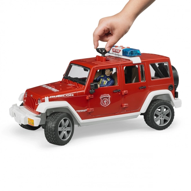 Červený požární Jeep Wrangler s figurkou a příslušenstvím