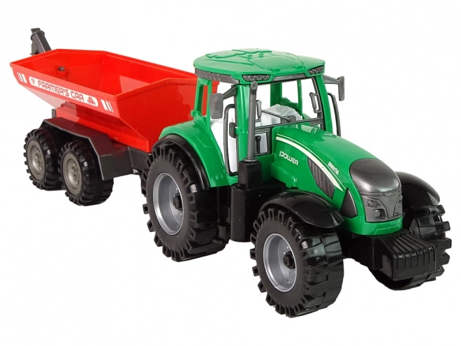 Zelený traktor s červeným třecím pohonem přívěsu