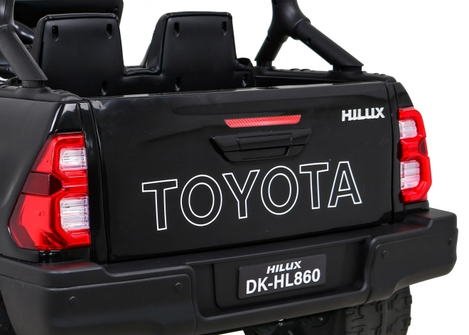 Toyota Hilux baterie pro děti černá + pohon 4x4 + dálkové ovládání + 2 nosiče zavazadel + rádio MP3 + LED dioda