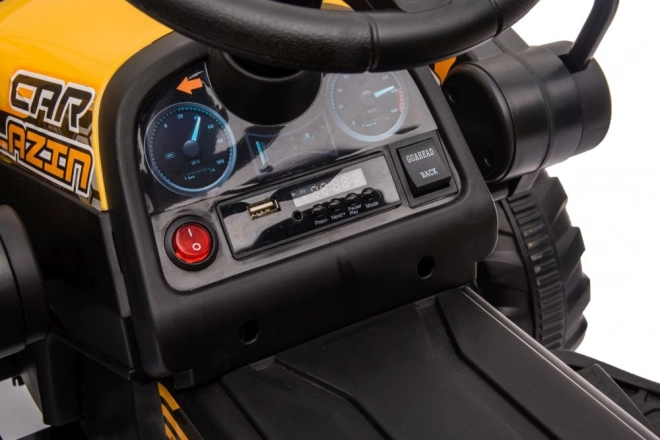 Elektrický traktor s lžící žlutý