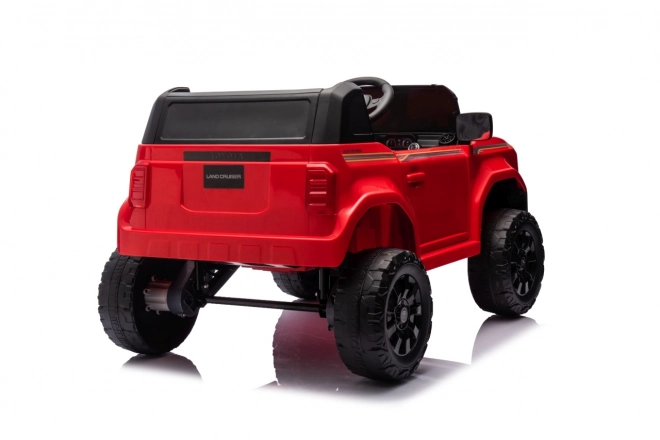 Czerwony pojazd Toyota Land Cruiser Prado