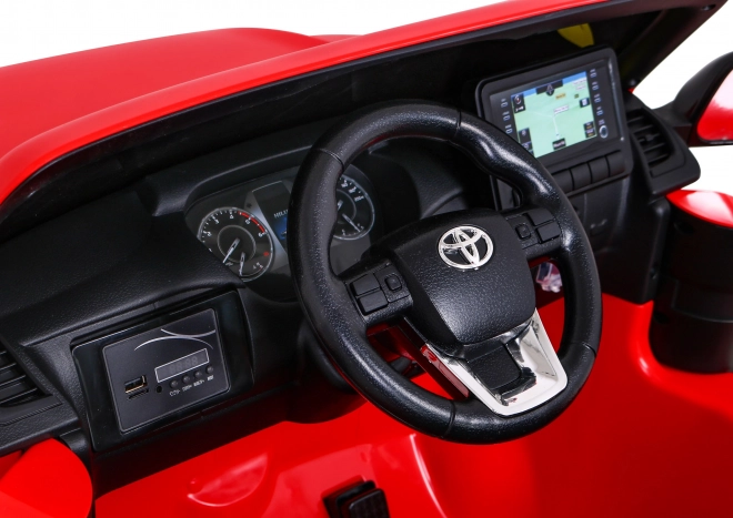 Toyota Hilux baterie pro děti Červená + pohon 4x4 + dálkové ovládání + 2 nosiče zavazadel + rádio MP3 + LED dioda