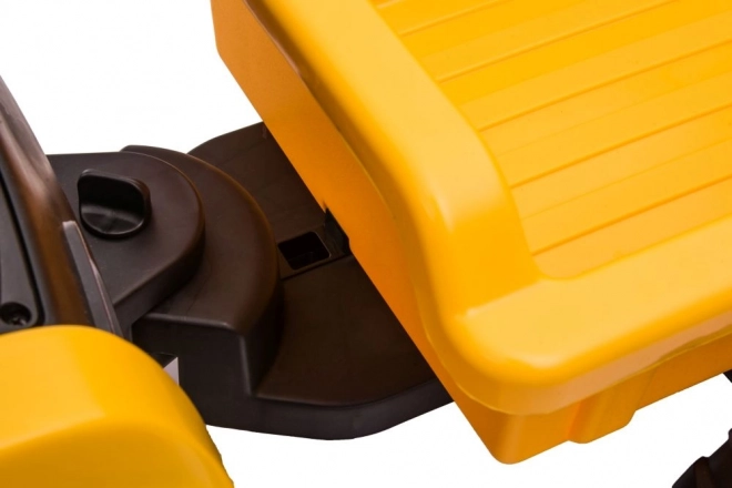 Elektrický traktor s lžící žlutý