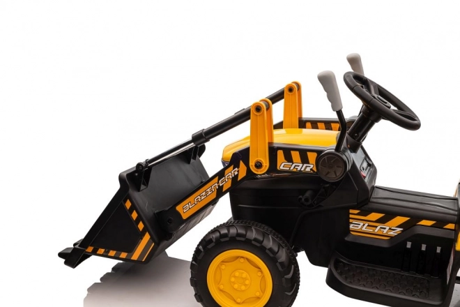 Elektrický traktor s lžící žlutý