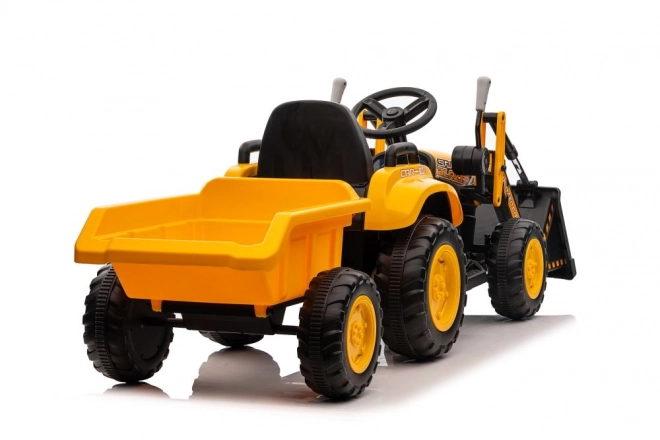 Elektrický traktor s lžící žlutý