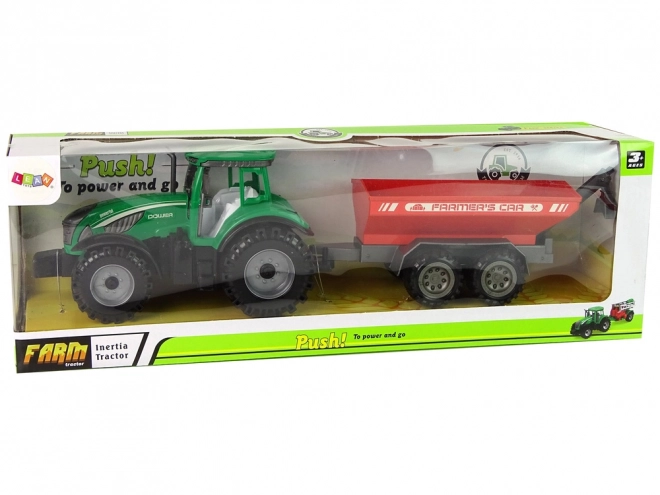 Zelený traktor s červeným třecím pohonem přívěsu