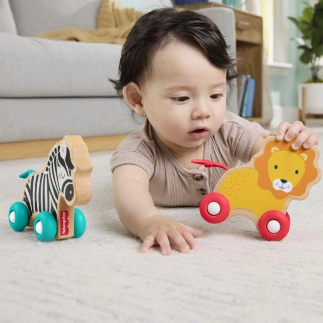 Dřevěná postrkovací zvířátka Lev a Zebra od Fisher-Price