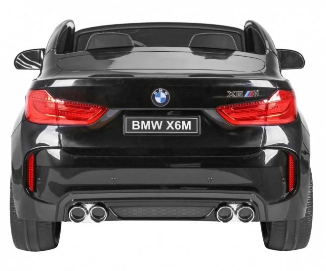 BMW X6M XXL pro 2 děti Lak černá + Dálkové ovládání + Eko kůže + Bezpečnostní pásy + Pomalý rozjezd + MP3 + LED