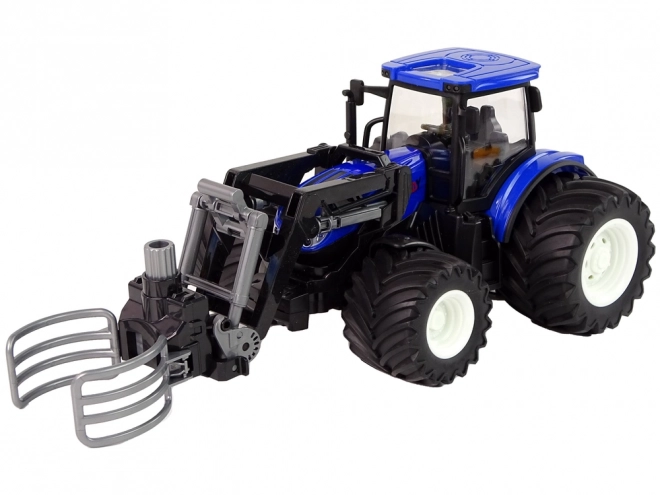 Dálkově ovládaný traktor s drapákem Blue