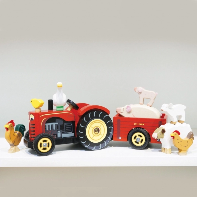 Le Toy Van červený traktor a přívěs