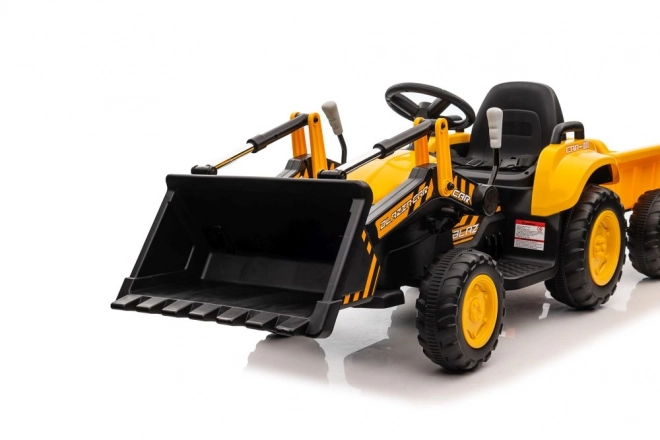 Elektrický traktor s lžící žlutý