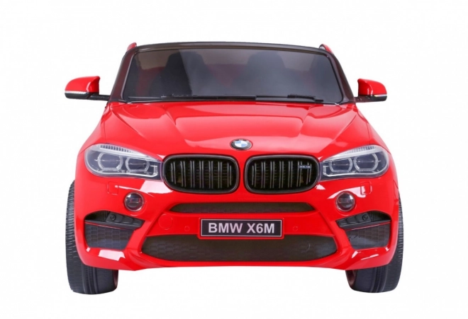 BMW X6M XXL pro 2 děti Červená + dálkové ovládání + eko kůže + bezpečnostní pásy + pomalý rozjezd + MP3 USB + LED dioda
