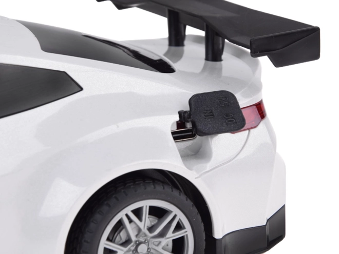 Elektrické auto se světelnými efekty a nabíjecí stanicí – Bílé