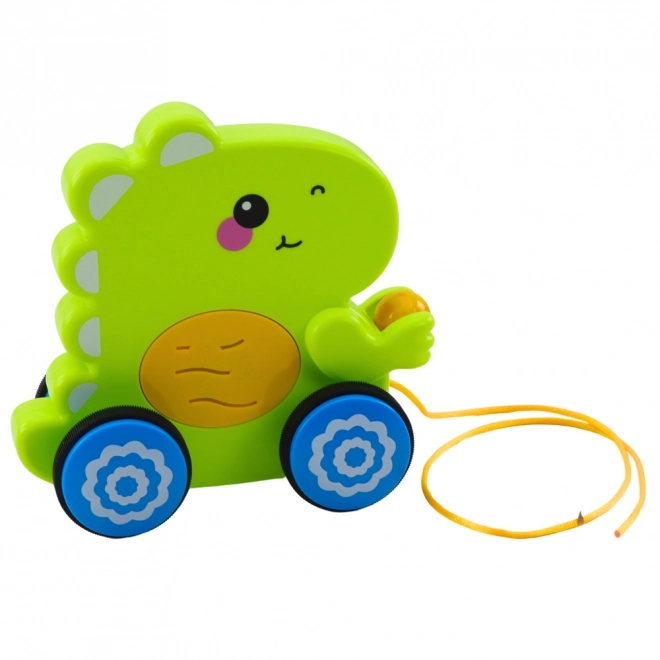 Interaktivní dinosaurus na tahání se zvuky a chrastítkem
