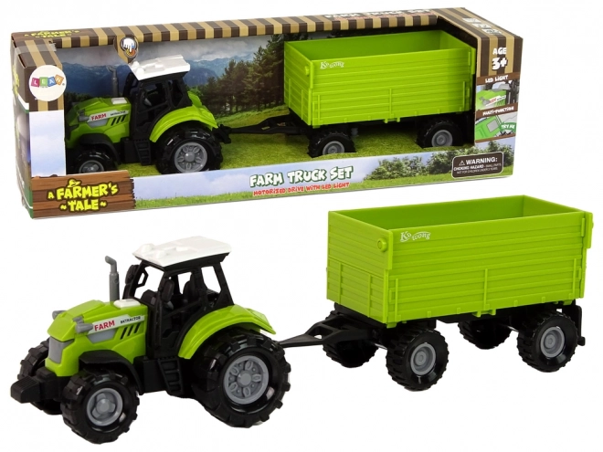 Zelený zemědělský traktor s přívěsem
