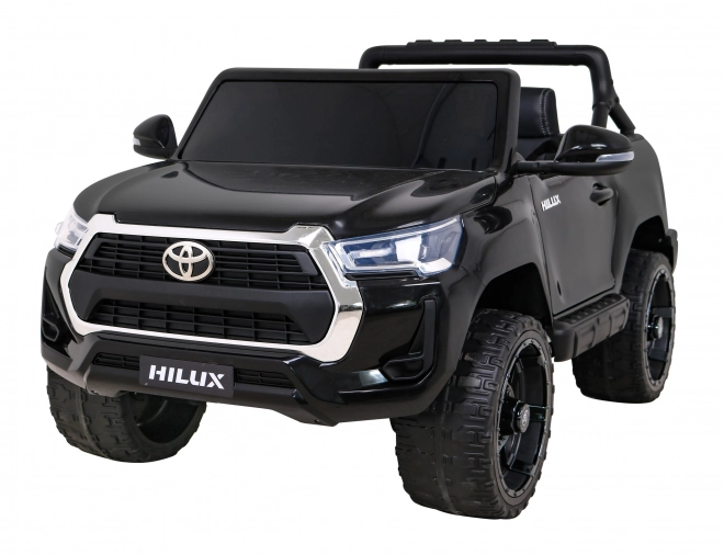 Toyota Hilux baterie pro děti černá + pohon 4x4 + dálkové ovládání + 2 nosiče zavazadel + rádio MP3 + LED dioda