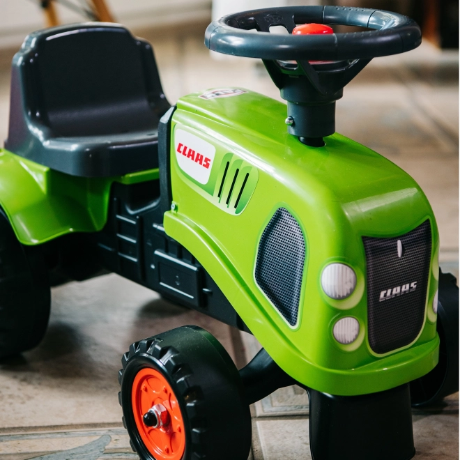 Odstrkovadlo traktor Claas zelené s volantem a valníkem